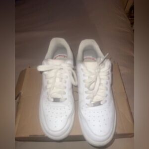 Nike White Low-Top Sneakers with Subtle Red Stitching